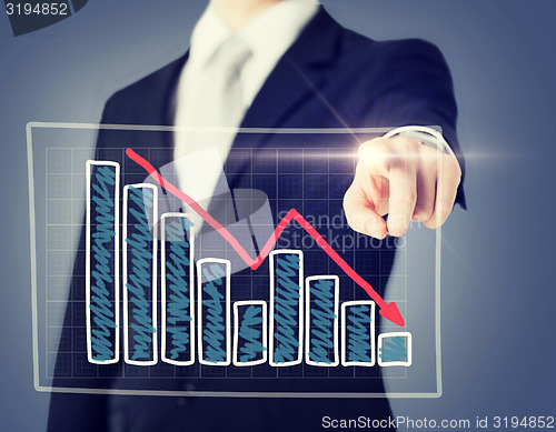 Image of businessman hand with chart on virtual screen