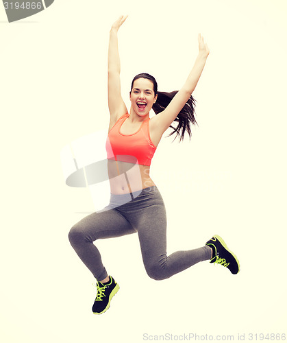 Image of sporty teenage girl jumping in sportswear