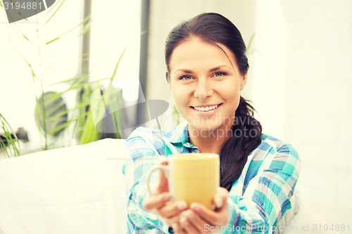 Image of lovely housewife with mug