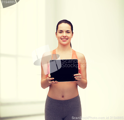 Image of sporty woman with tablet pc blank screen