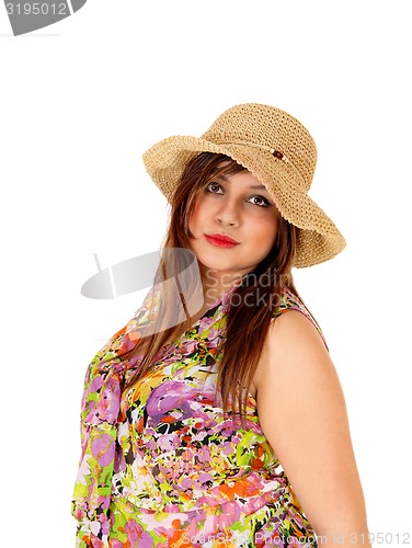 Image of Serious girl with straw hat.