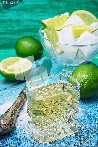 Image of alcoholic cocktail with additions of lime