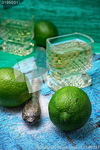 Image of alcoholic cocktail with additions of lime