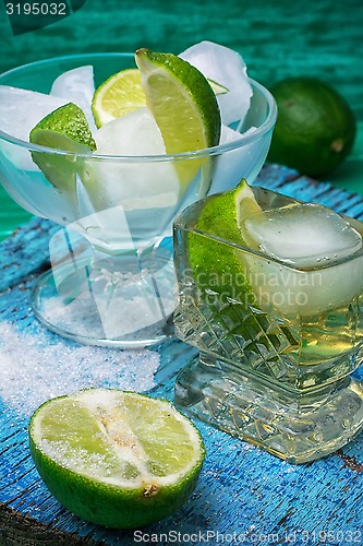 Image of alcoholic cocktail with additions of lime