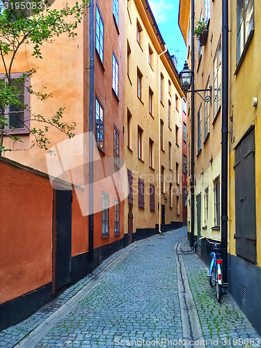 Image of Narrow street with colorful buildings in Stockholm