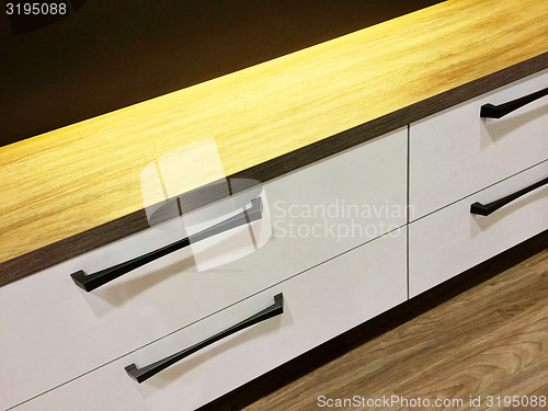 Image of Modern chest of drawers with wooden top