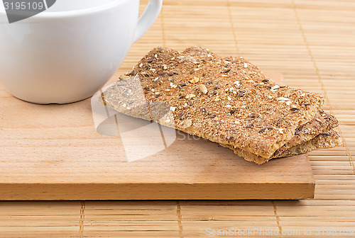 Image of Crispbread and a fragment of a white cup.