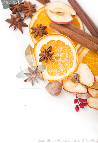 Image of Christmas spices and dried orange sliceson 