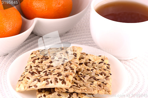 Image of sweet cake and fruits, tea (coffee) cup and fruits