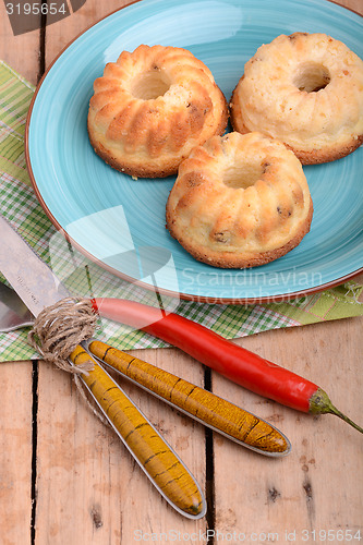 Image of cheese cake on blue plate with red pepper
