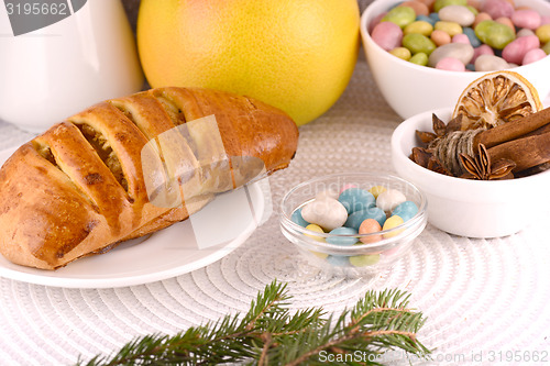 Image of sweet cake on white plate and fruits