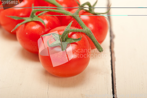 Image of fresh cherry tomatoes on a cluster