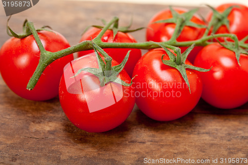 Image of fresh cherry tomatoes on a cluster