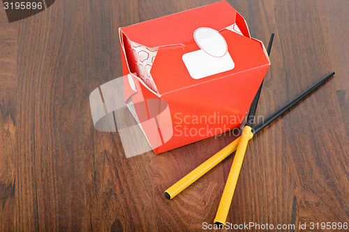 Image of Chinese take away red food box with chopstocks