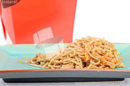 Image of Meat, noodles and red take away container
