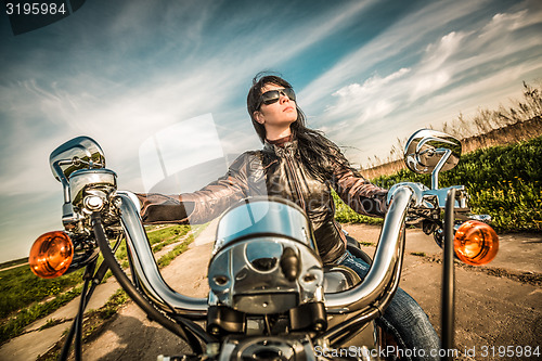 Image of Biker girl on a motorcycle