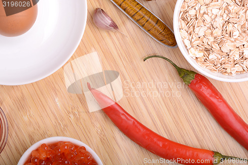 Image of bowl of corn flakes and red pepper