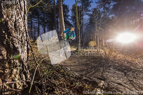 Image of Mountainbiker through an off road trail