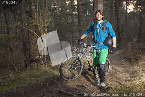 Image of Young man with his ATB in the forest