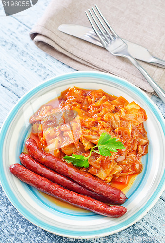 Image of fried cabbage with sausages