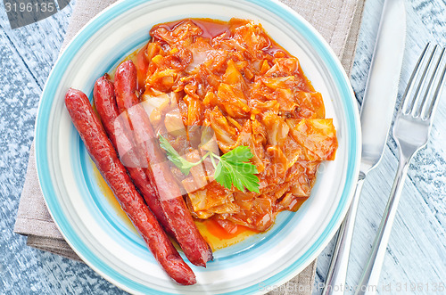 Image of fried cabbage with sausages