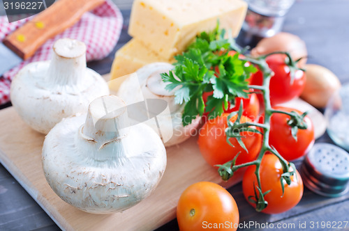 Image of mushroom and tomato with cheese