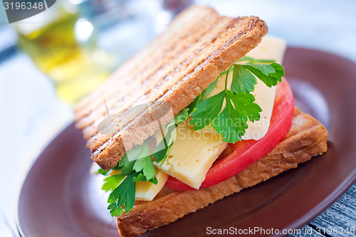 Image of toasts with cheese and tomato