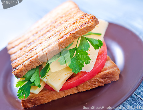 Image of toasts with cheese and tomato