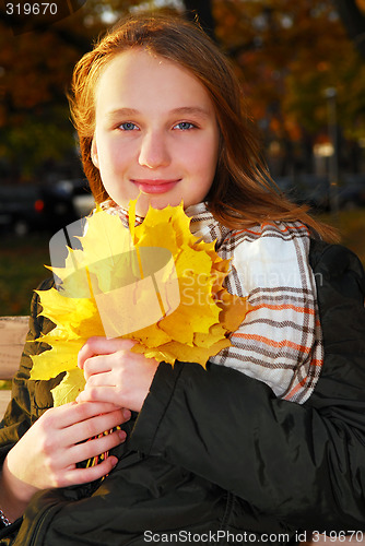 Image of Girl with fall leaves
