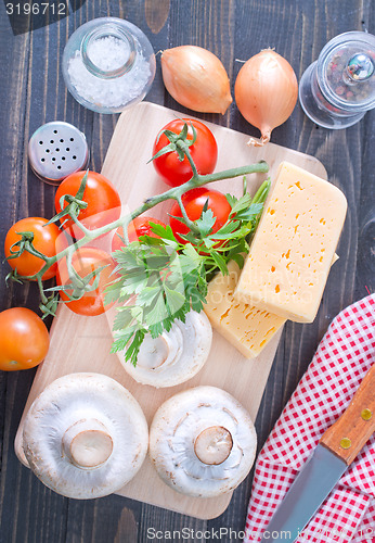 Image of mushroom and tomato with cheese