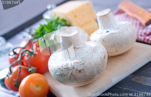 Image of mushroom and tomato with cheese