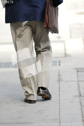 Image of Businessman walking