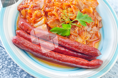 Image of fried cabbage with sausages