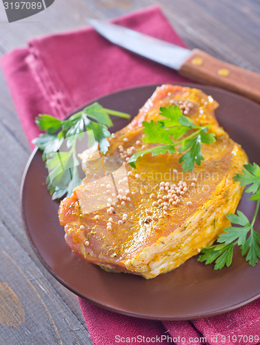 Image of raw meat with marinade