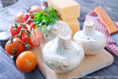 Image of mushroom and tomato with cheese