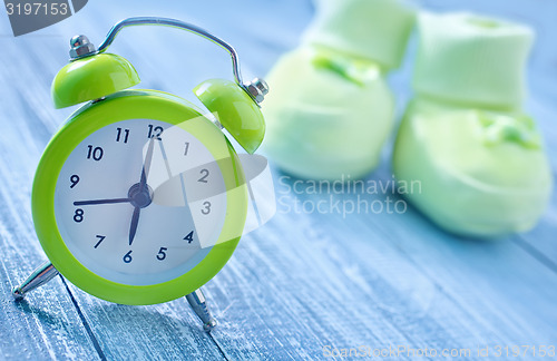 Image of clock and baby socks