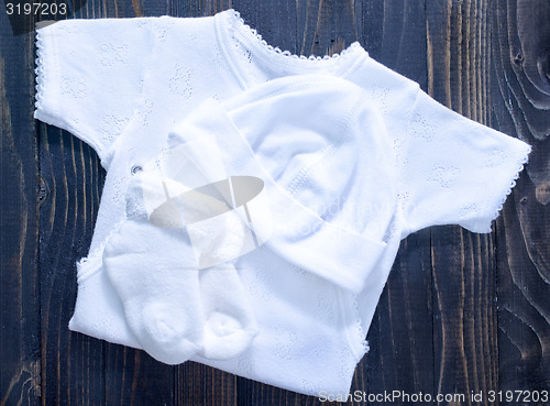 Image of baby clothes on a table