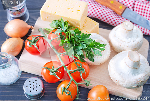 Image of mushroom and tomato with cheese