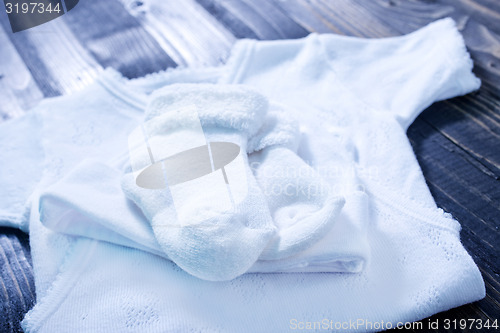 Image of baby clothes on a table