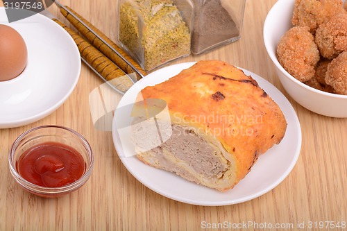 Image of Fresh meat on white plate with tomato, spice and eggs 