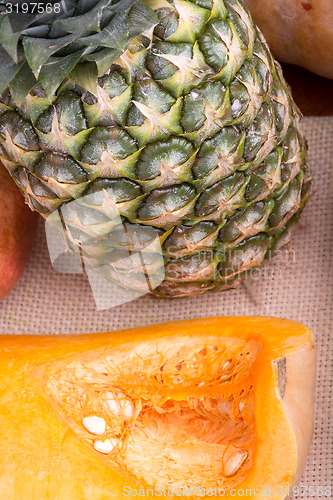 Image of fresh pineapple with corn and orange