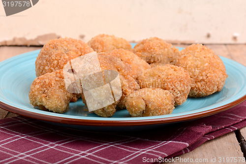 Image of meat chop on blue plate