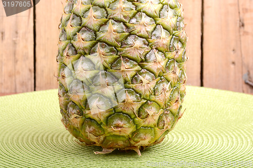 Image of fresh pineapple with corn and orange