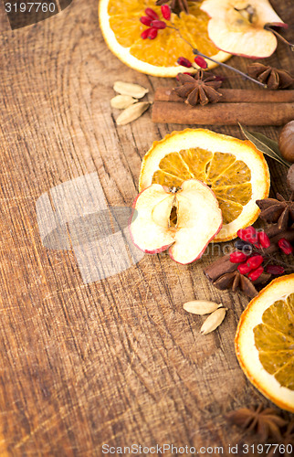 Image of Christmas spices and dried orange sliceson 