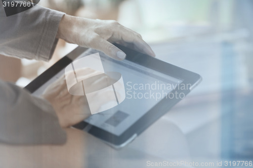 Image of Woman with digital tablet