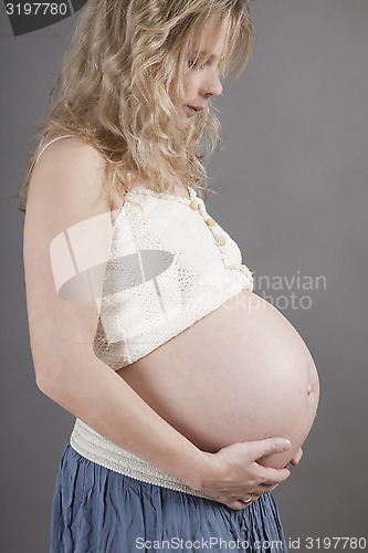 Image of young woman with baby bump