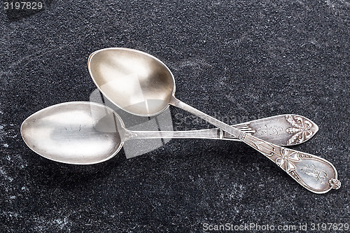 Image of two old silver spoons