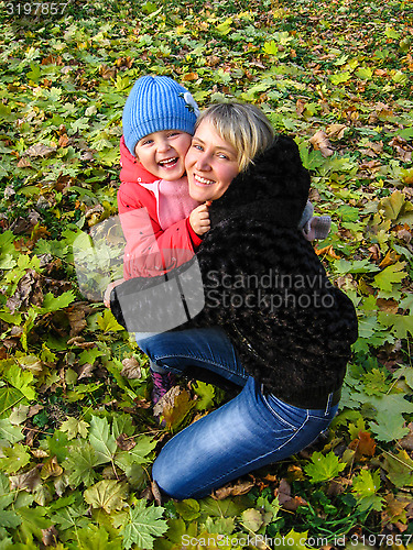 Image of Happy and smiling mother and her child