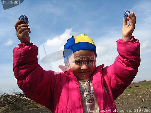 Image of girl with Easter eggs in hands