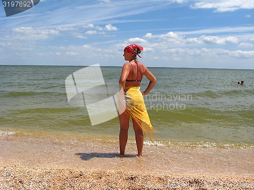 Image of girl standing at the seacoast